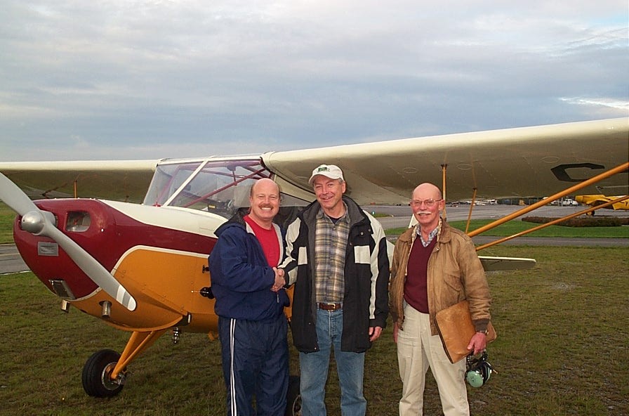 Chief Flying Instructor David Parry with Lloyd Blackburn and Pilot Examiner Donn Richardson following Lloyd's successful completion of his Private Pilot Flight Test, Langley Flying School
